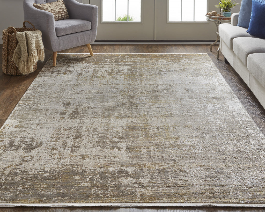 3' X 5' Taupe Ivory And Gold Abstract Power Loom Distressed Area Rug With Fringe