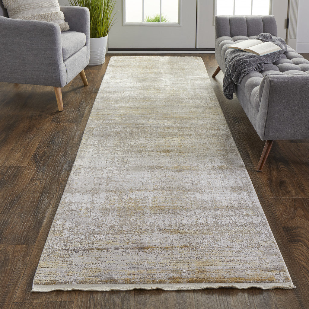 3' X 5' Taupe Ivory And Gold Abstract Power Loom Distressed Area Rug With Fringe