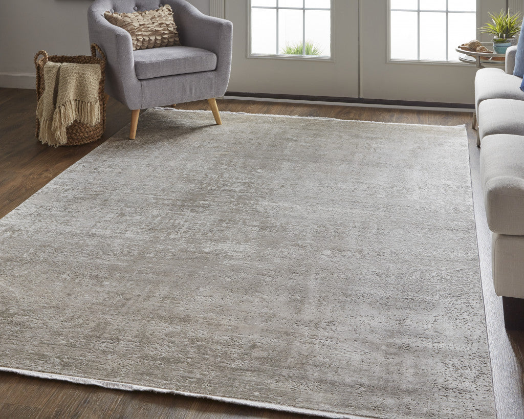 3' X 5' Taupe Ivory And Gold Abstract Power Loom Distressed Area Rug With Fringe