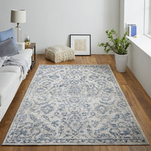 4' X 6' Blue Gray And Ivory Floral Power Loom Distressed Area Rug