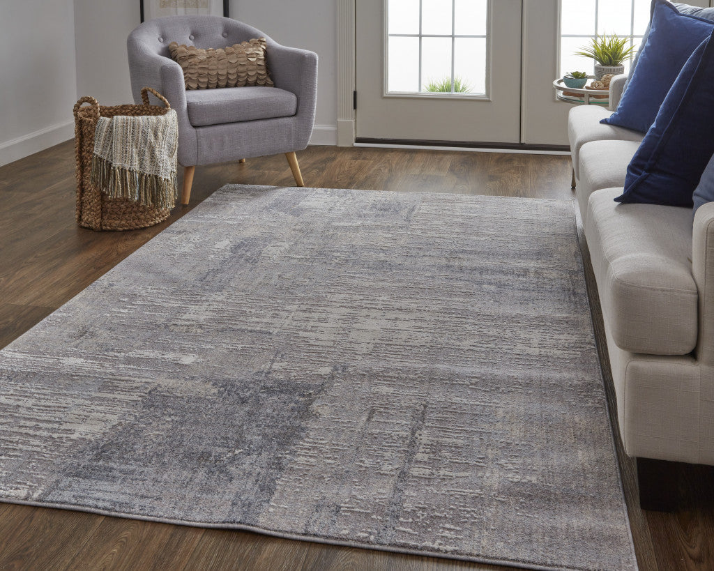 4' X 6' Taupe Tan And Blue Abstract Power Loom Distressed Stain Resistant Area Rug