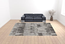4' X 6' Ivory Brown And Gray Abstract Power Loom Stain Resistant Area Rug