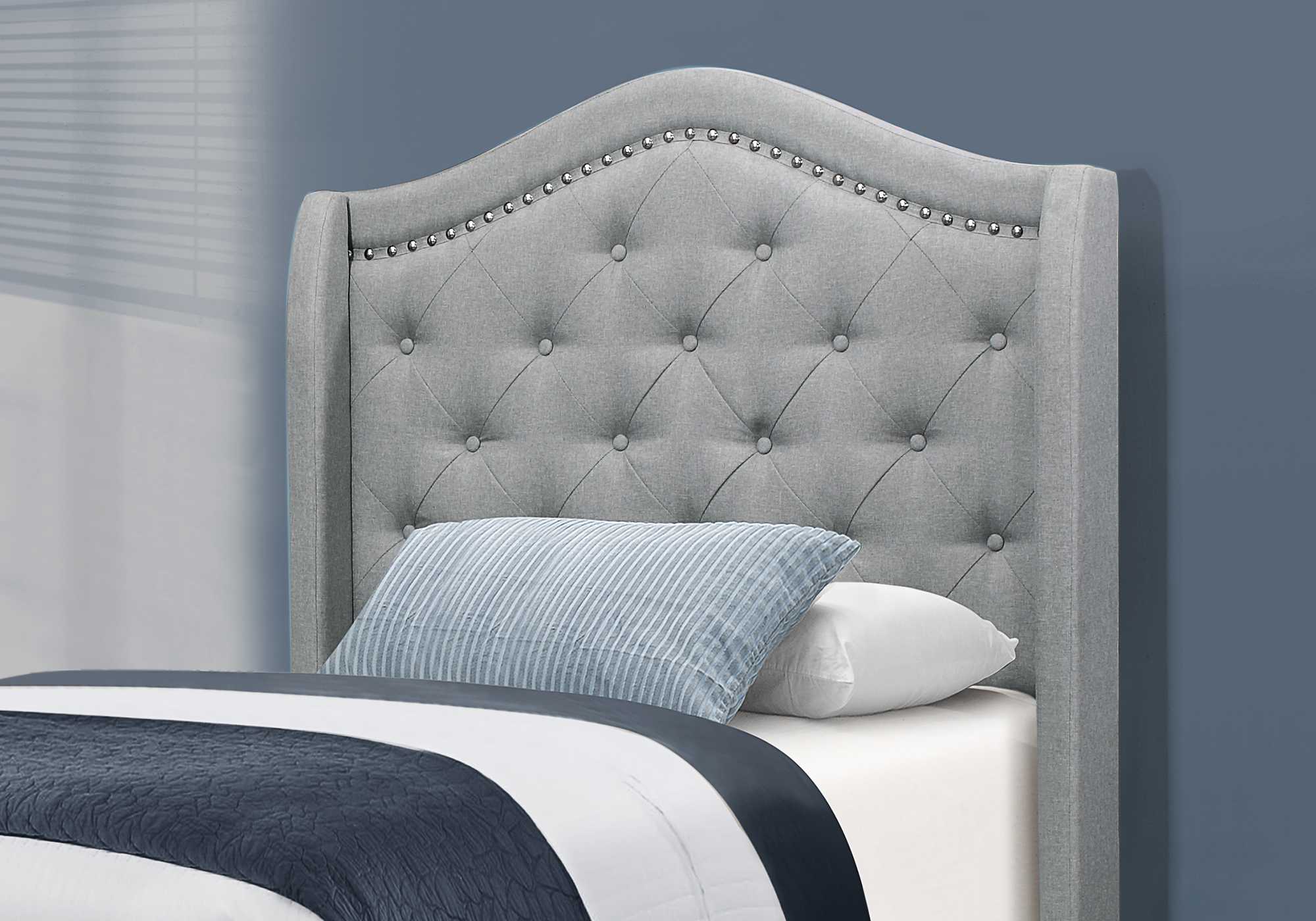 Tufted Grey Standard Bed Upholstered With Nailhead Trim And With Headboard