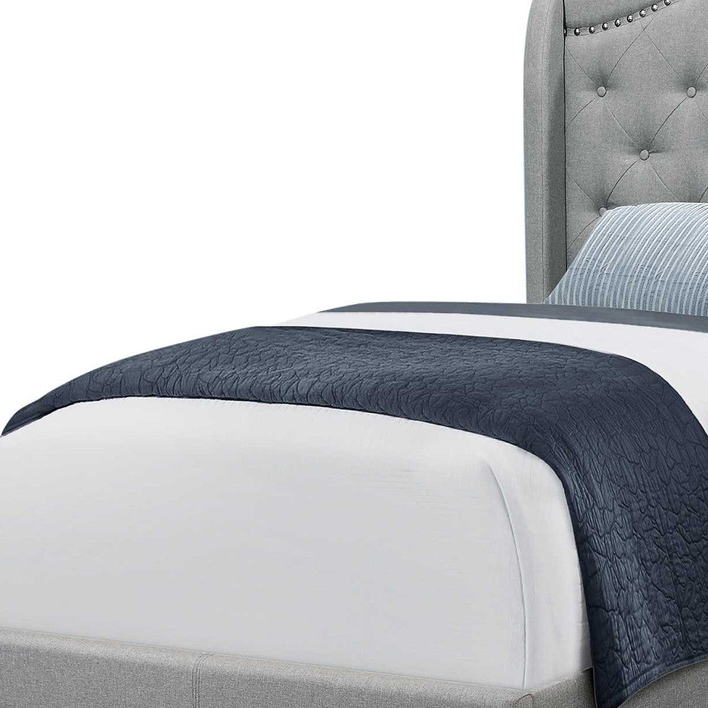 Tufted Grey Standard Bed Upholstered With Nailhead Trim And With Headboard