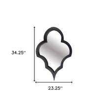 Espejo de pared con marco de madera negra