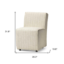 Fully Upholstered Cream Toned Fabric Dining Chair On Casters