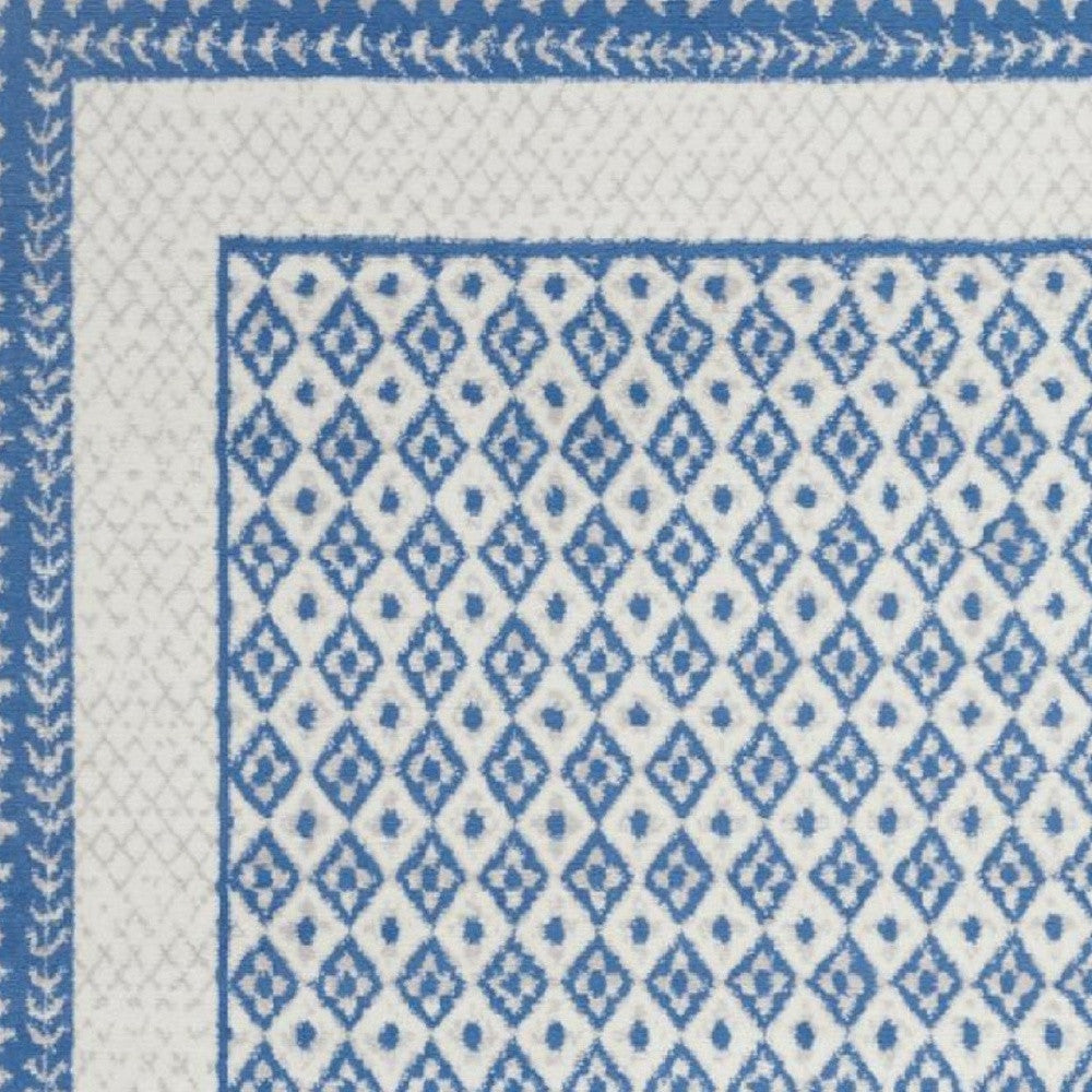 4’ X 6’ Ivory And Blue Geometric Area Rug