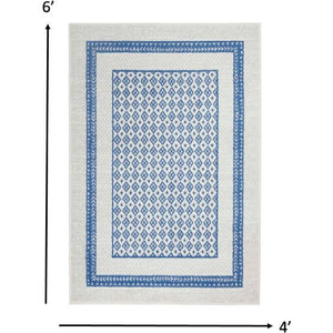 4’ X 6’ Ivory And Blue Geometric Area Rug