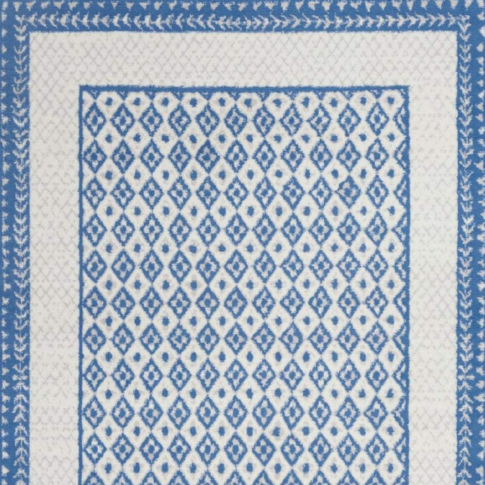 4’ X 6’ Ivory And Blue Geometric Area Rug