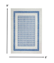 4’ X 6’ Ivory And Blue Geometric Area Rug