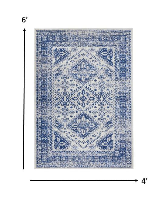 4’ X 6’ Ivory And Navy Geometric Area Rug