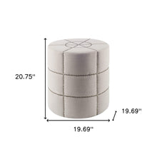 Otomana color crema con detalles de metal