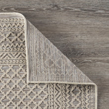 5' X 7' Tan/Brown Indoor Outdoor Area Rug