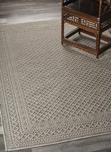 5' X 7' Tan/Brown Indoor Outdoor Area Rug