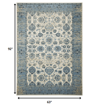 5’ x 8’ Blue Ivory Distressed Oriental Area Rug