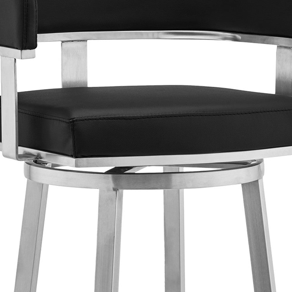 38" Black And Silver Faux Leather Swivel Low Back Bar Height Chair With Footrest