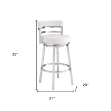White And Silver Faux Leather And Iron Swivel Low Back Counter Height Bar Chair With Footrest 35