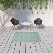 5' X 7' Aqua And Teal Argyle Indoor Outdoor Area Rug