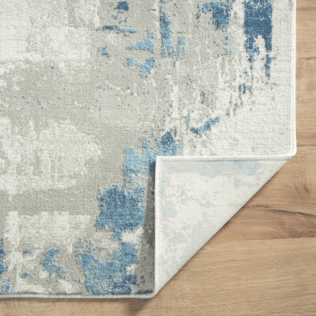 2' X 6' Ivory Gray And Blue Abstract Stain Resistant Area Rug