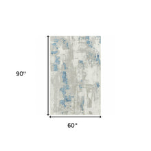 5' X 8' Ivory Gray And Blue Abstract Power Loom Stain Resistant Area Rug