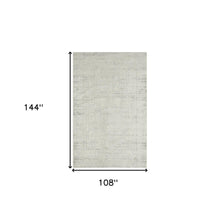 9' X 12' Ivory And Gray Floral Power Loom Distressed Stain Resistant Area Rug