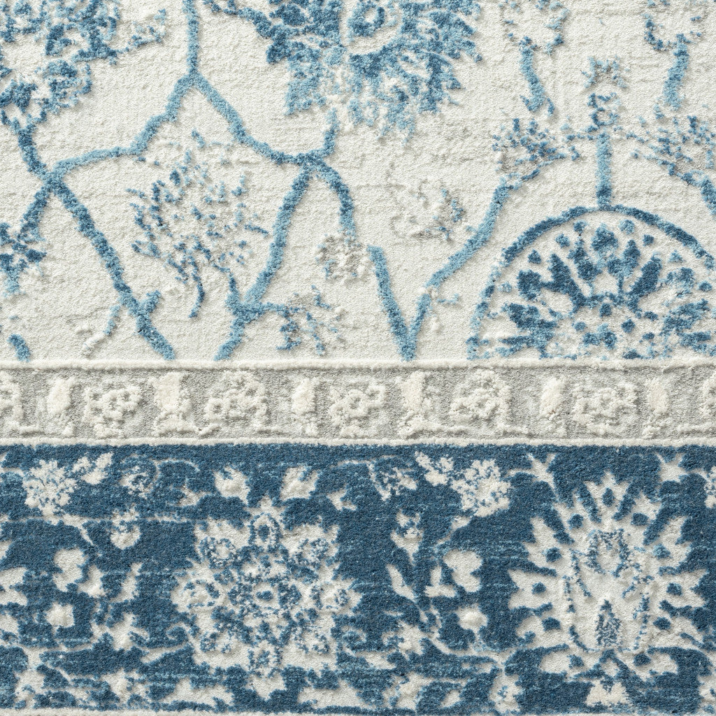 5' X 8' Blue Gray And Ivory Floral Power Loom Stain Resistant Area Rug