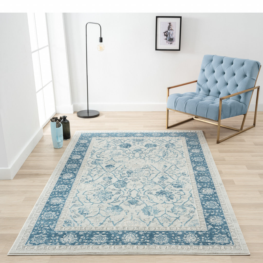 9' X 12' Blue Gray And Ivory Floral Power Loom Stain Resistant Area Rug
