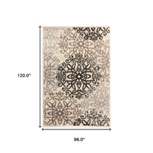 8' X 10' Tan Gray And Black Floral Medallion Stain Resistant Area Rug