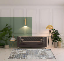 5' X 8' Brown And Ivory Floral Power Loom Distressed Stain Resistant Area Rug