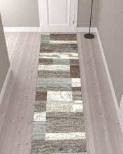 12' Light Blue and Ivory Patchwork Resistant Runner Rug