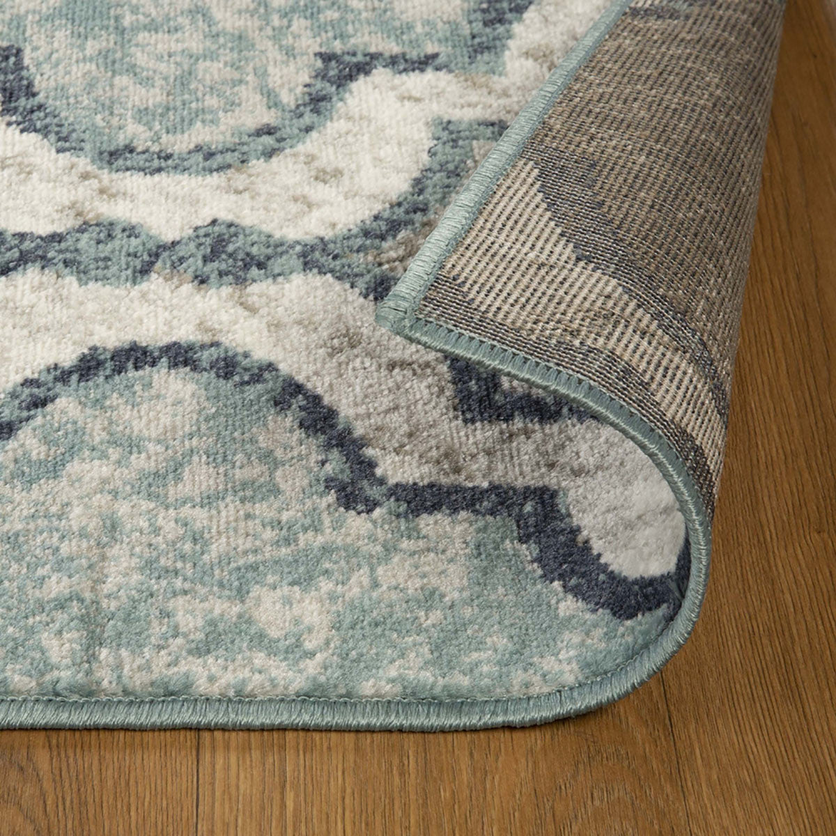 7' X 9' Deep Royal Quatrefoil Power Loom Distressed Stain Resistant Area Rug