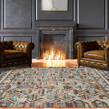 8' X 10' Ivory Blue Pink Gold And Green Geometric Hand Woven Area Rug With Fringe