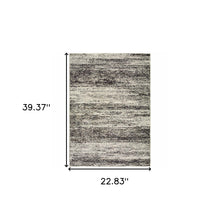 2' X 3' Charcoal Grey Silver And Ivory Abstract Power Loom Stain Resistant Area Rug