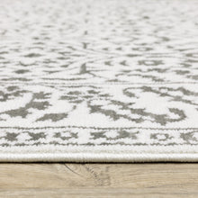 5' X 8' Grey And White Floral Power Loom Stain Resistant Area Rug