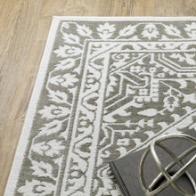 6' X 9' Grey And White Oriental Power Loom Stain Resistant Area Rug