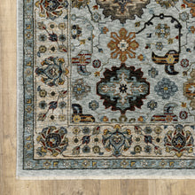 3' X 5' Blue Beige Grey Green Yellow And Rust Oriental Power Loom Stain Resistant Area Rug With Fringe