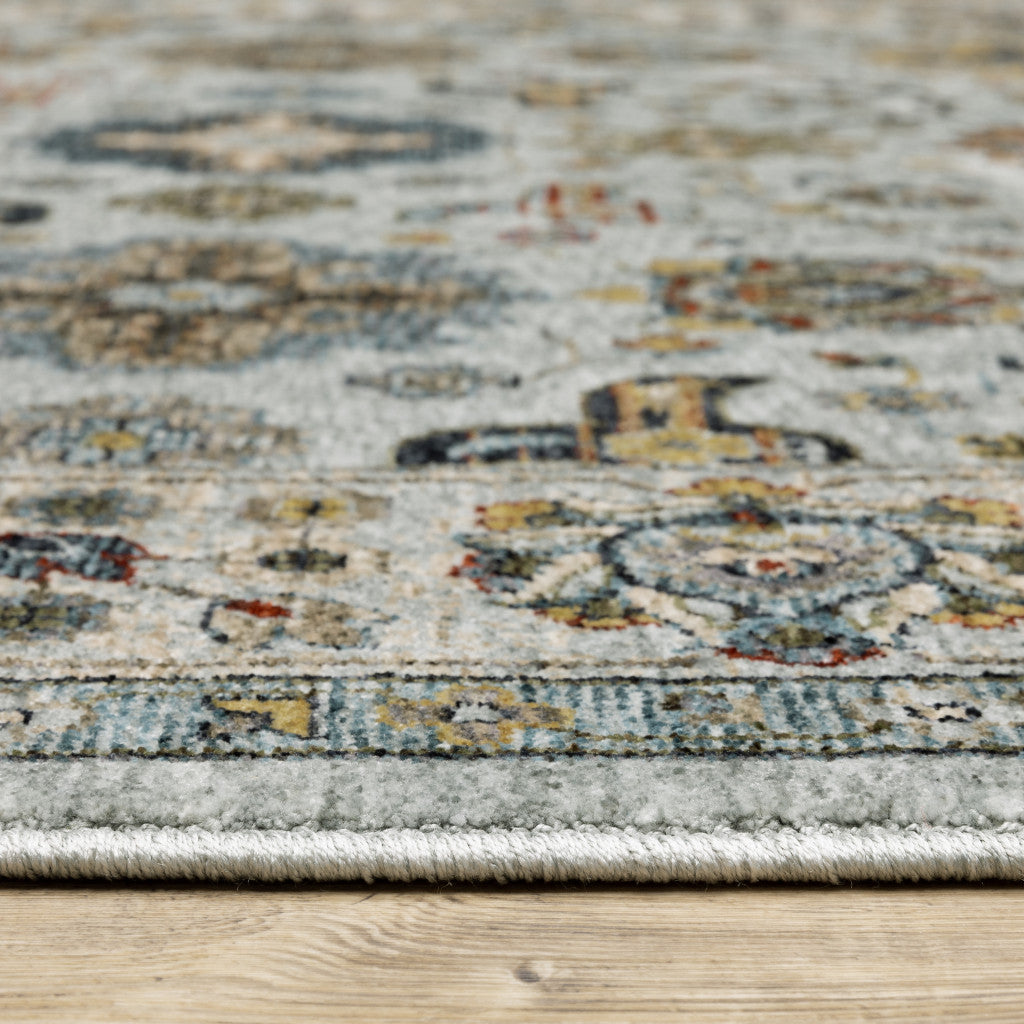 6' X 9' Blue Beige Grey Green Yellow And Rust Oriental Power Loom Stain Resistant Area Rug With Fringe