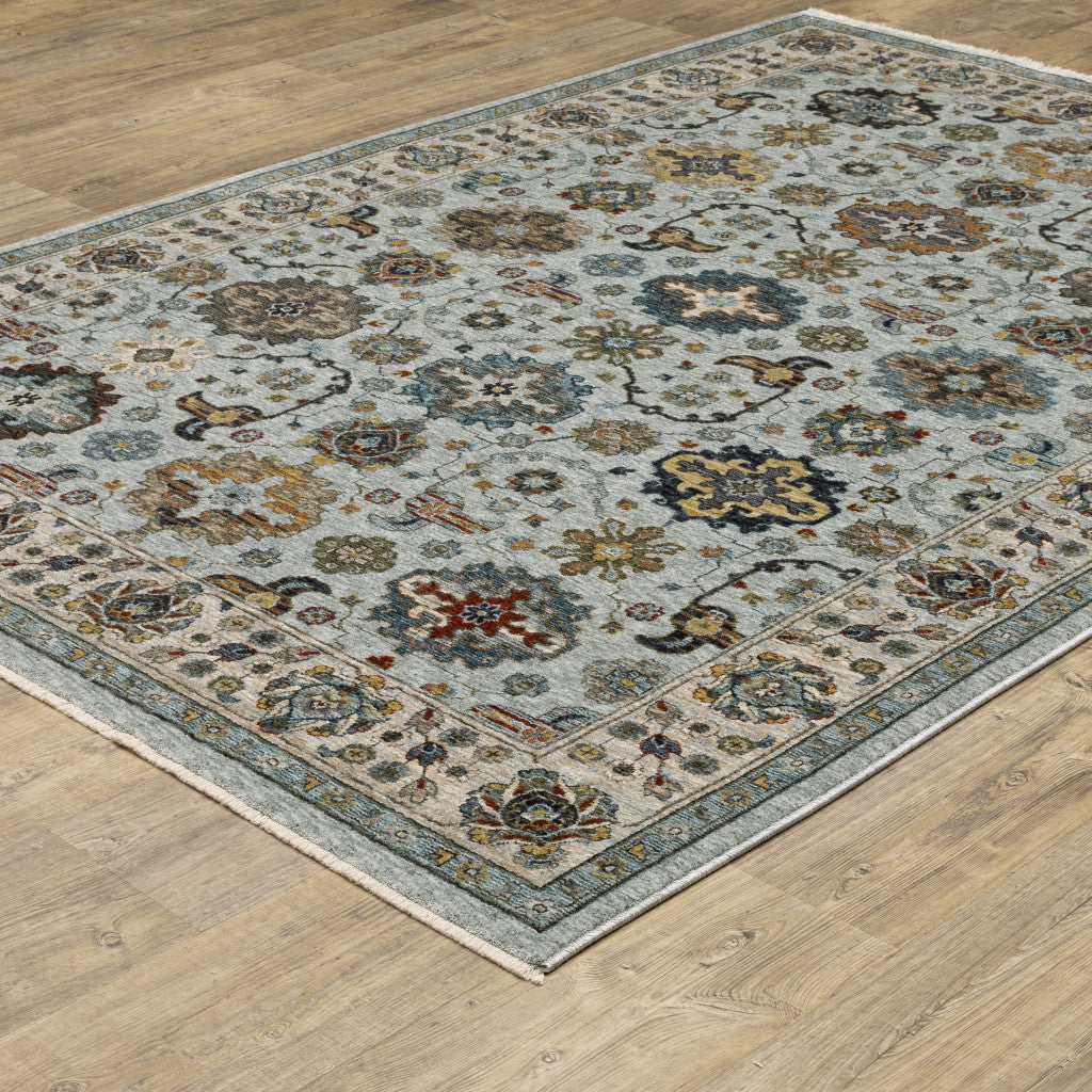 6' X 9' Blue Beige Grey Green Yellow And Rust Oriental Power Loom Stain Resistant Area Rug With Fringe