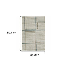 3' X 5' Grey Teal Beige And Tan Geometric Power Loom Stain Resistant Area Rug