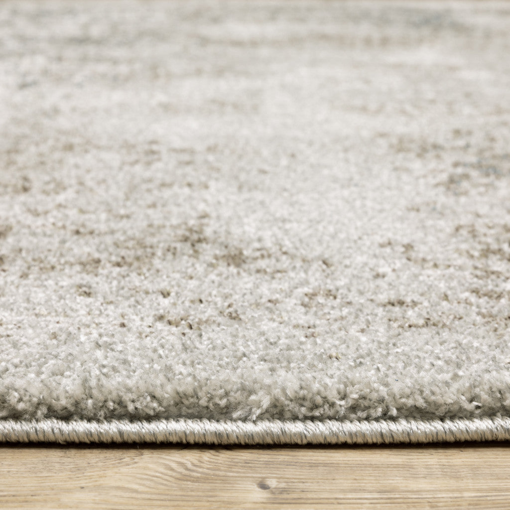 6' X 9' Grey Beige And Teal Oriental Power Loom Stain Resistant Area Rug