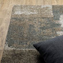 5' X 8' Teal Blue Grey Tan And Beige Geometric Power Loom Stain Resistant Area Rug