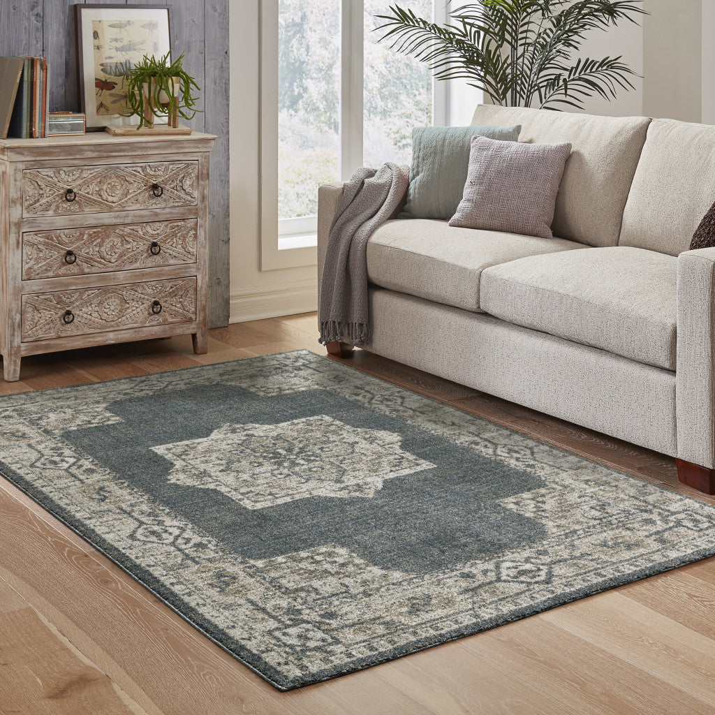 6' X 9' Blue And Beige Oriental Power Loom Stain Resistant Area Rug