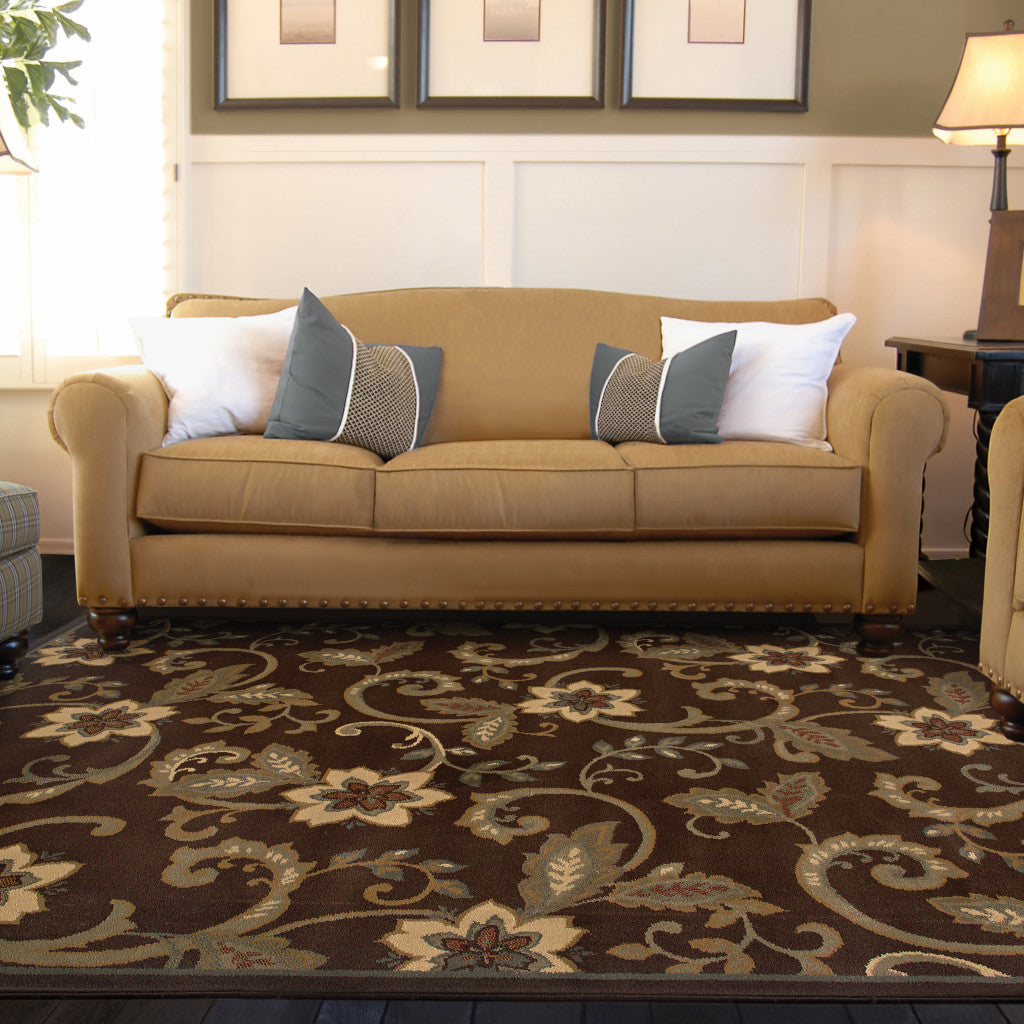 5' X 8' Brown Ivory Blue Rust Gold And Green Floral Power Loom Stain Resistant Area Rug