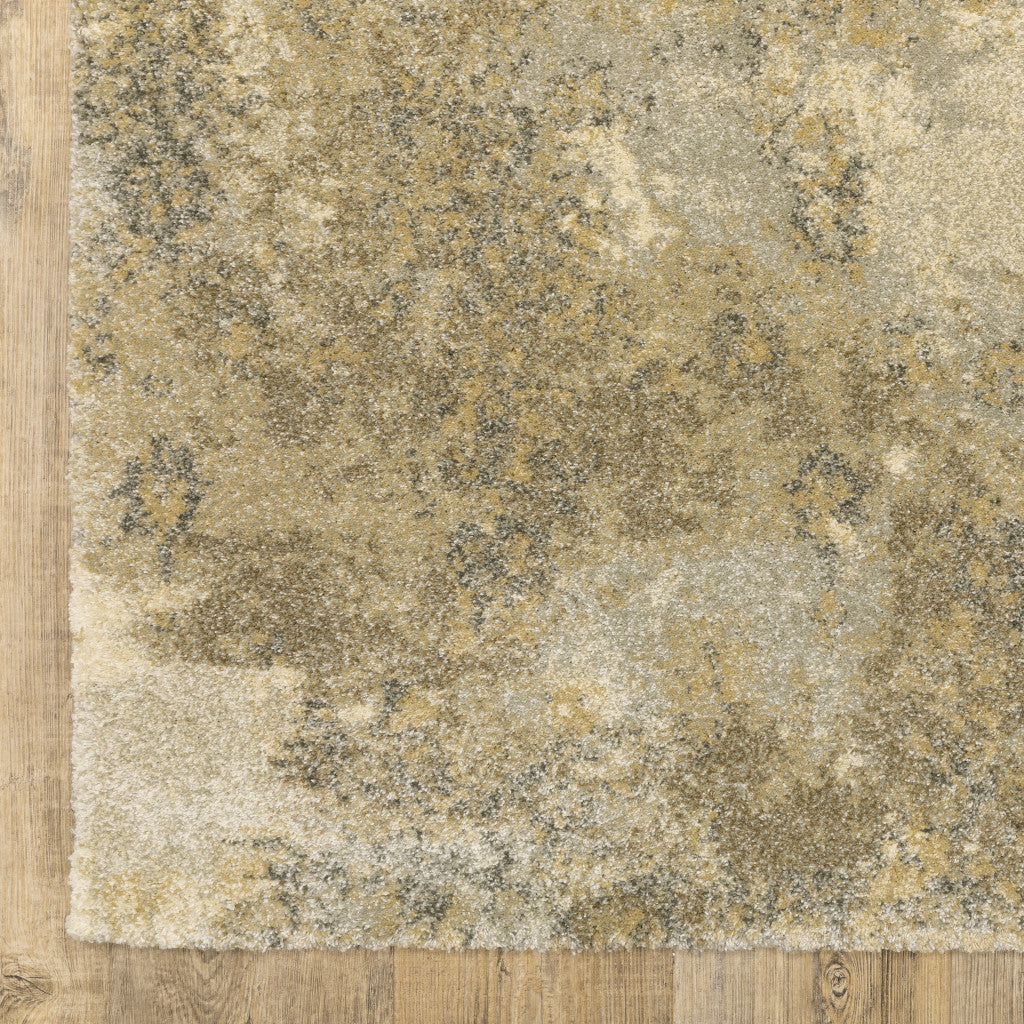 5' X 8' Beige Grey Tan And Gold Abstract Power Loom Stain Resistant Area Rug