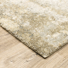 6' X 9' Beige Grey Tan And Gold Abstract Power Loom Stain Resistant Area Rug