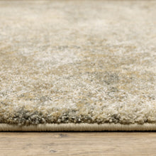 6' X 9' Beige Grey Tan And Gold Abstract Power Loom Stain Resistant Area Rug