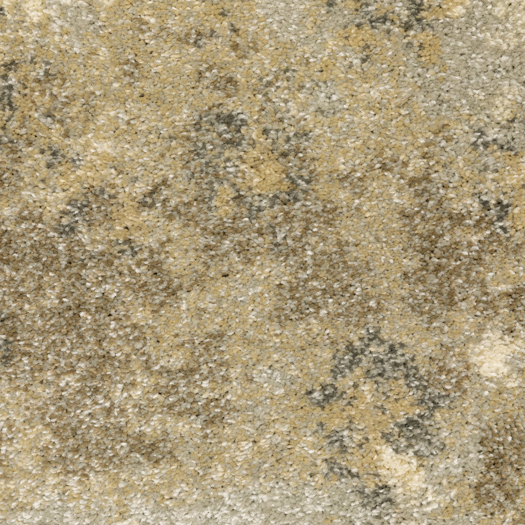6' X 9' Beige Grey Tan And Gold Abstract Power Loom Stain Resistant Area Rug