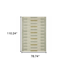 6' X 9' Beige Grey Gold And Green Geometric Power Loom Stain Resistant Area Rug