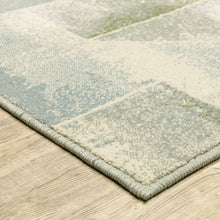 8' X 10' Blue Green Grey Gold And Ivory Geometric Power Loom Stain Resistant Area Rug