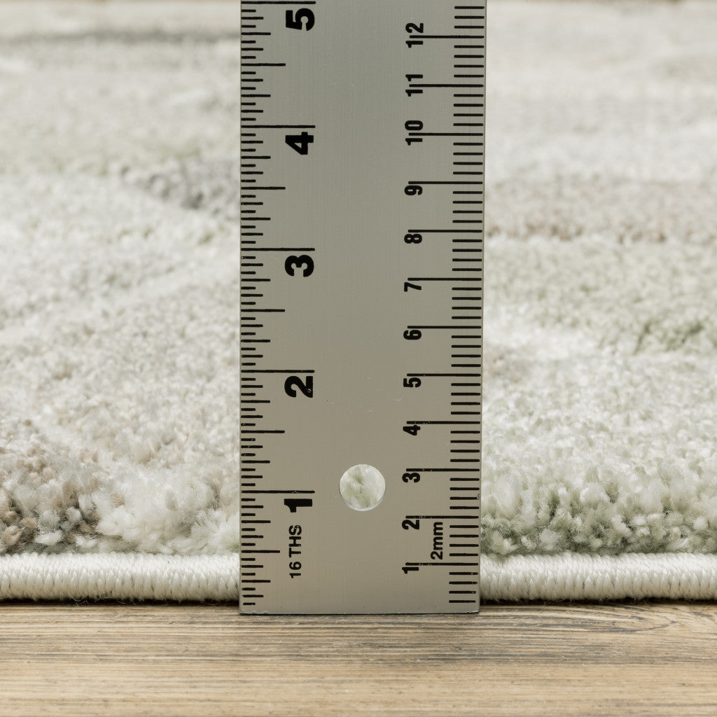 5' X 8' Beige Brown Grey Tan Sage And Pale Blue Geometric Power Loom Stain Resistant Area Rug